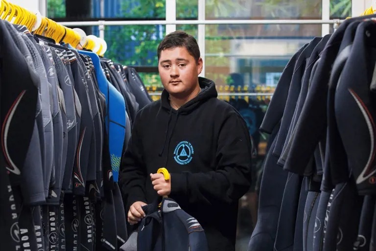 noah-edwards-in-the-wetsuit-room-tile.jpg#asset:2382